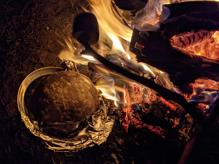 make popcorn over the fire pit with children at bush playgroup in the Blue Mountains