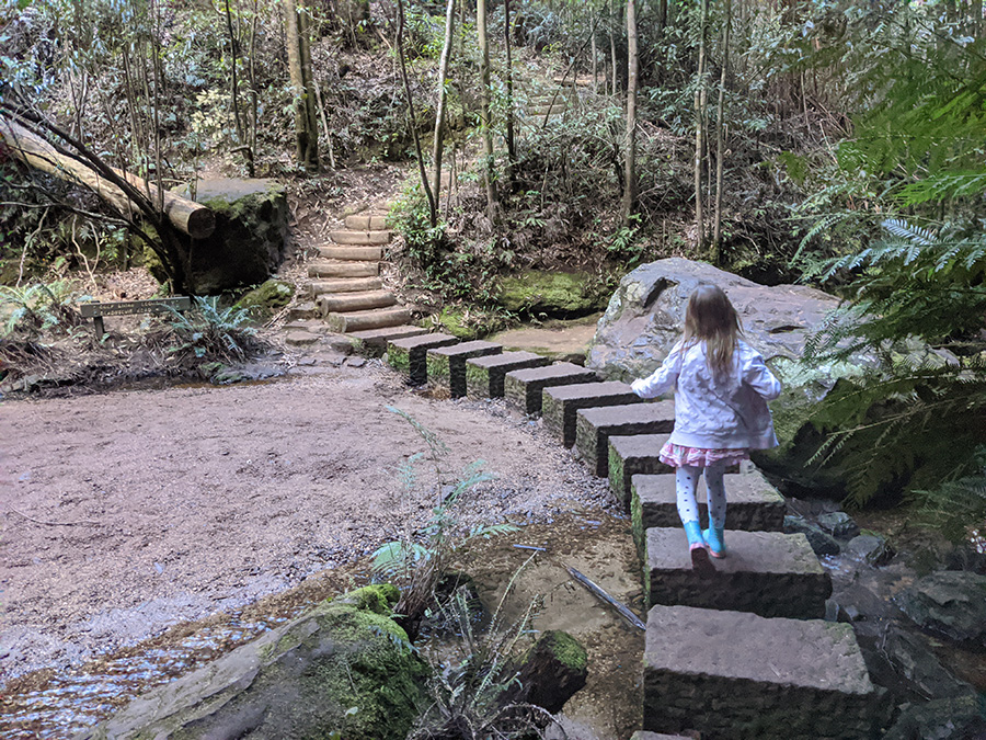 Little girl is active outdoors on a bushwalk in the Blue Mountains