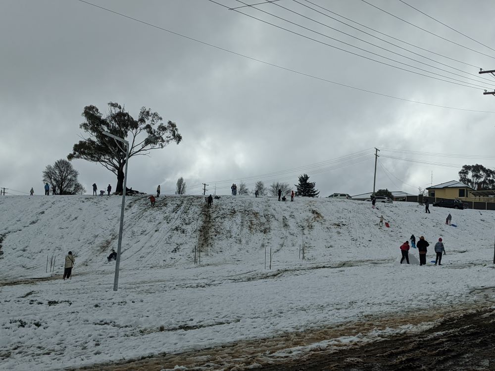 tobogganing in the snow in oberon, blue mountains