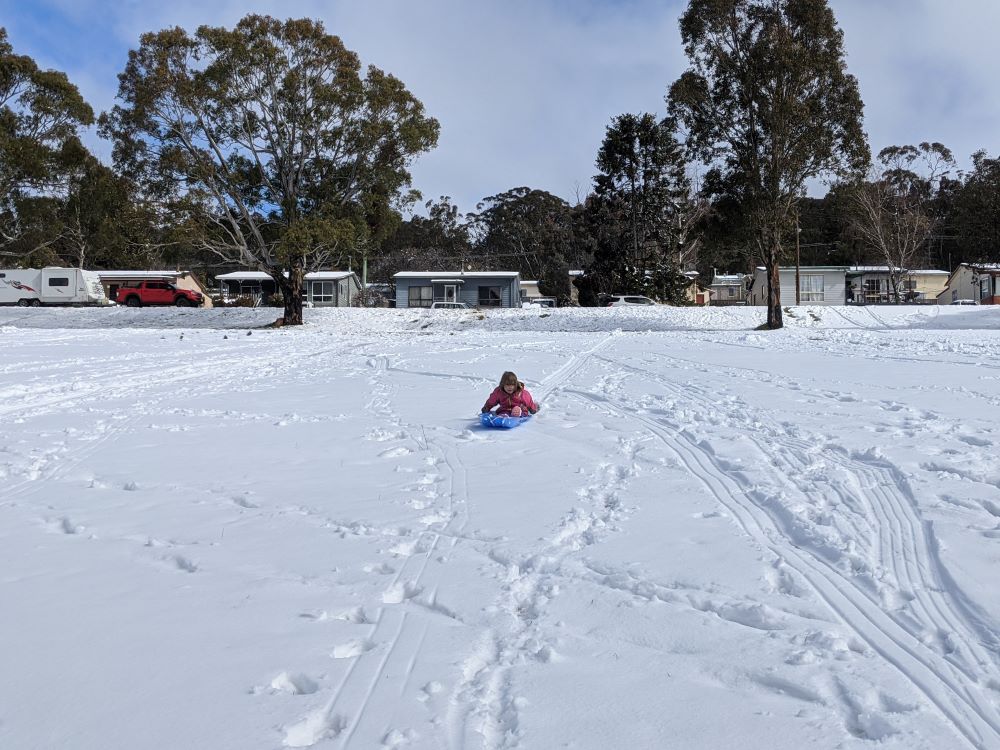 tobogganing in the snow in oberon, blue mountains