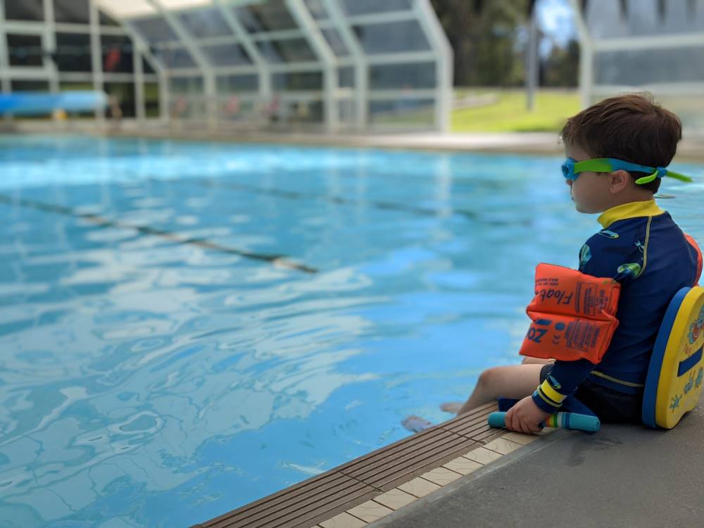 glenbrook pool water play safety little boy on the edge in safety gear