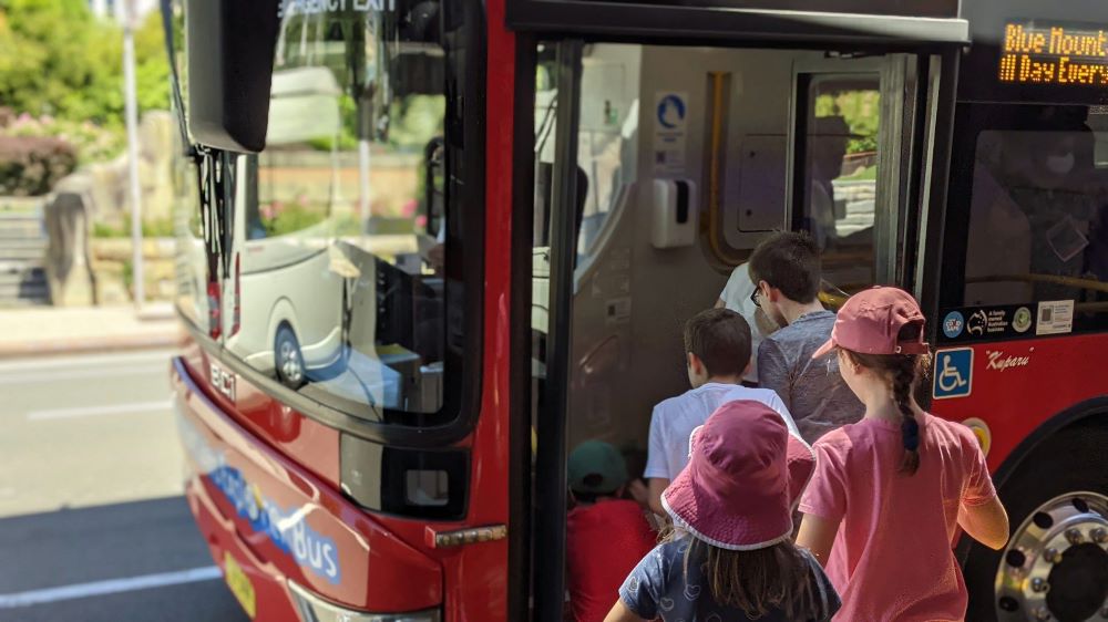 very excited children hopping on the blue mountains explorer bus