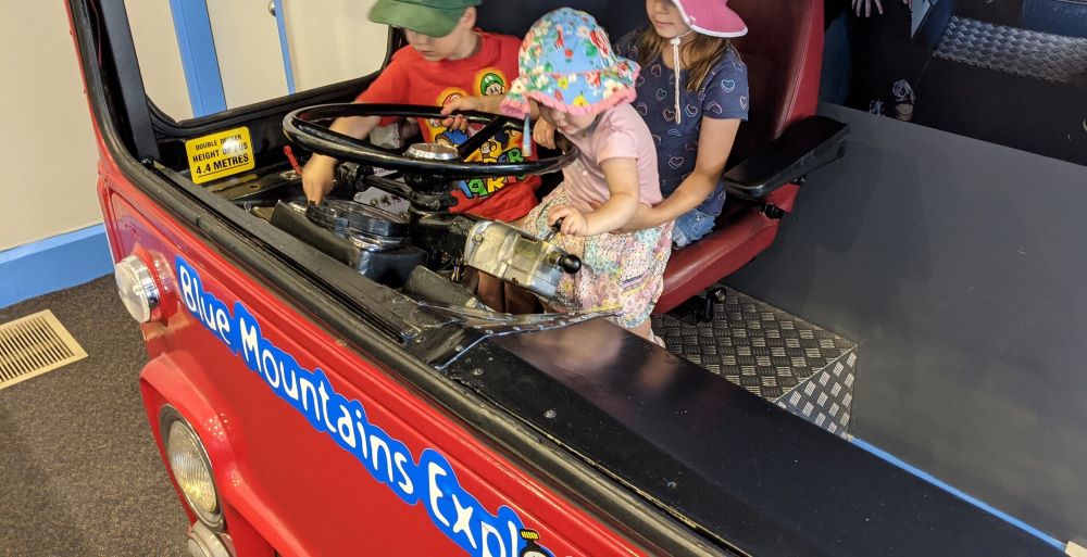 children driving the blue mountains explorer bus