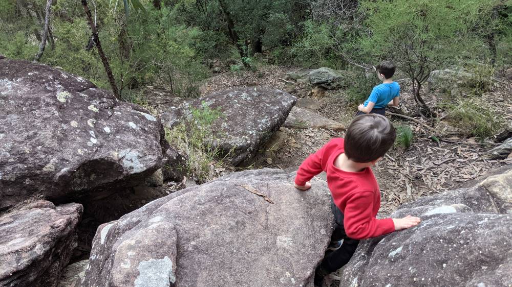 Duck Hole Creek kids climbing down rocks