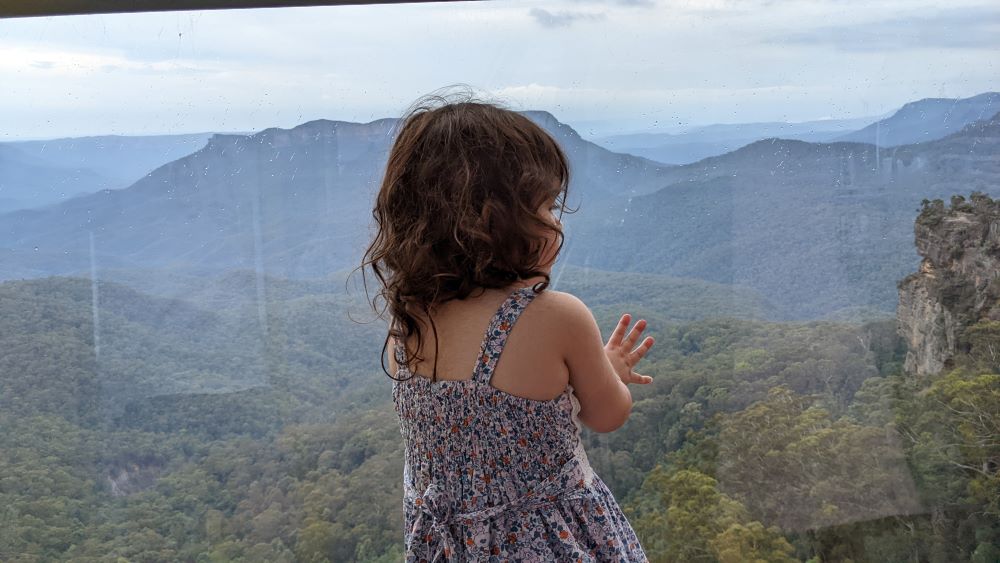 little girl riding the scenic cableway at scenic world