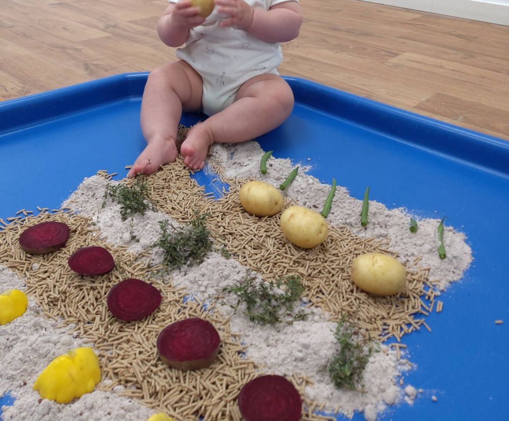 sensory garden playgroup lawson childplaying with rice