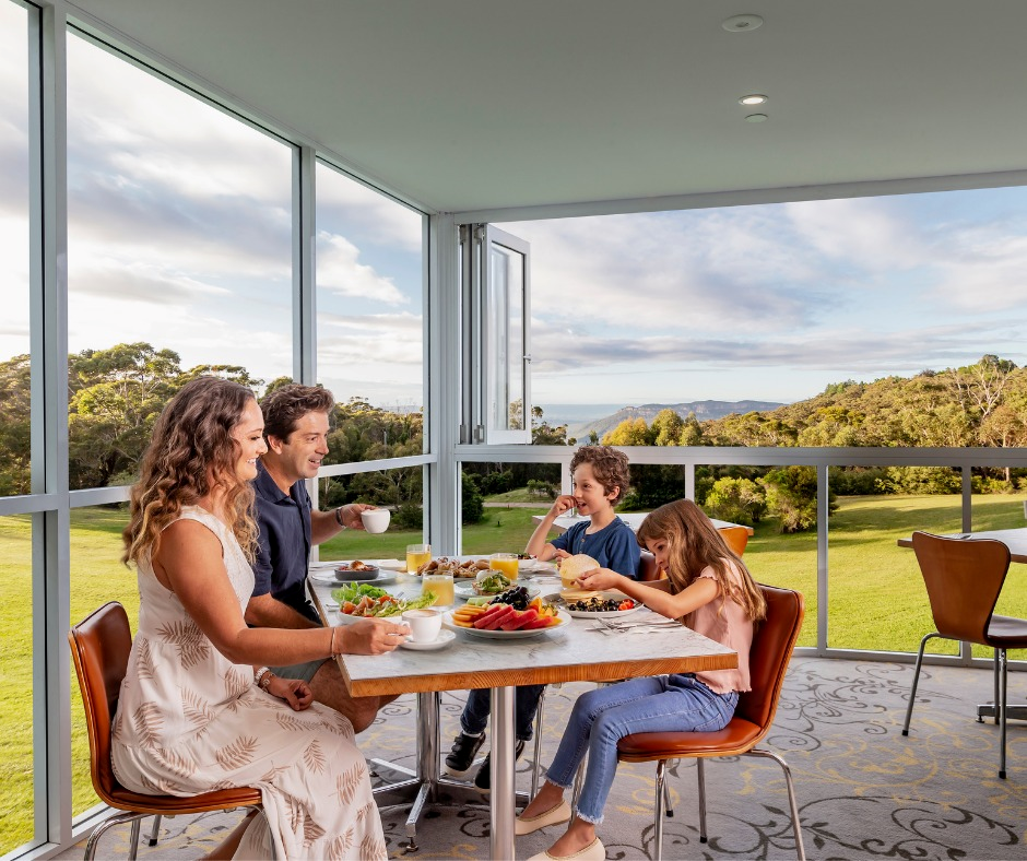 a family of four (Mum, dad, boy and girl) enjoying breakfast at Jamison's Restaurant at the Fairmont Hotel Blue Mountains