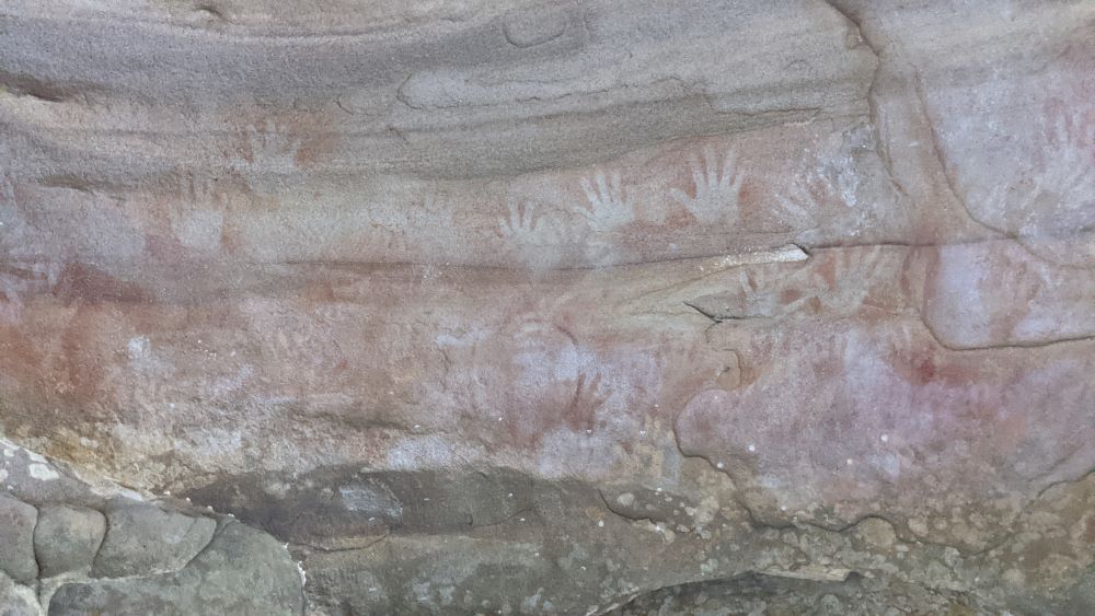 Aboriginal hand stencils artwork at red hands cave glenbrook