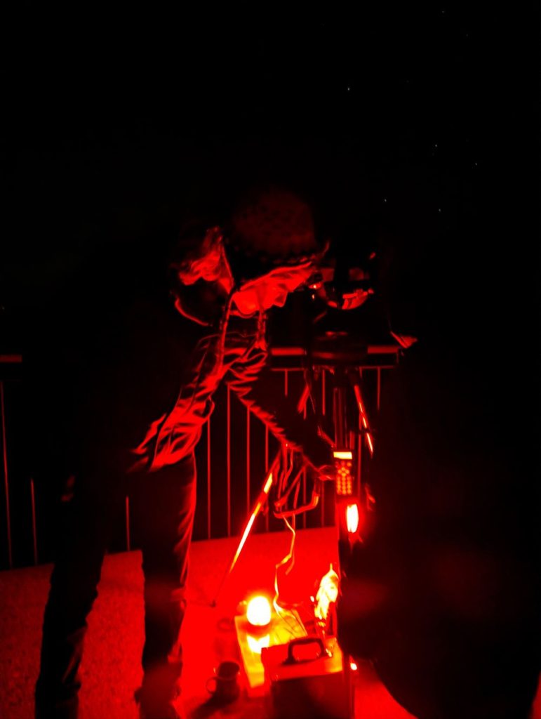 Tom the astronomer adjusting t he computerised telescope on a Blue Mountains Stargazing tour