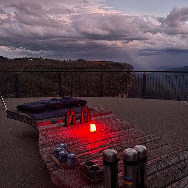 A seat set up with hot chocolate, soft bl;ankets and binoculars ready for a stargazing tour at Wentworth Falls.