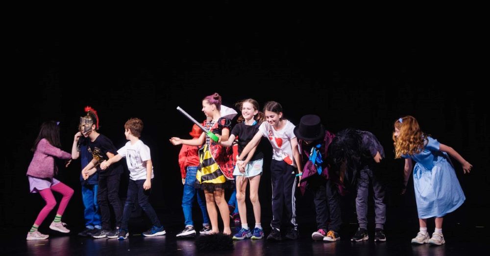 children performing on stage at q theatre penrith for their school holiday workshops